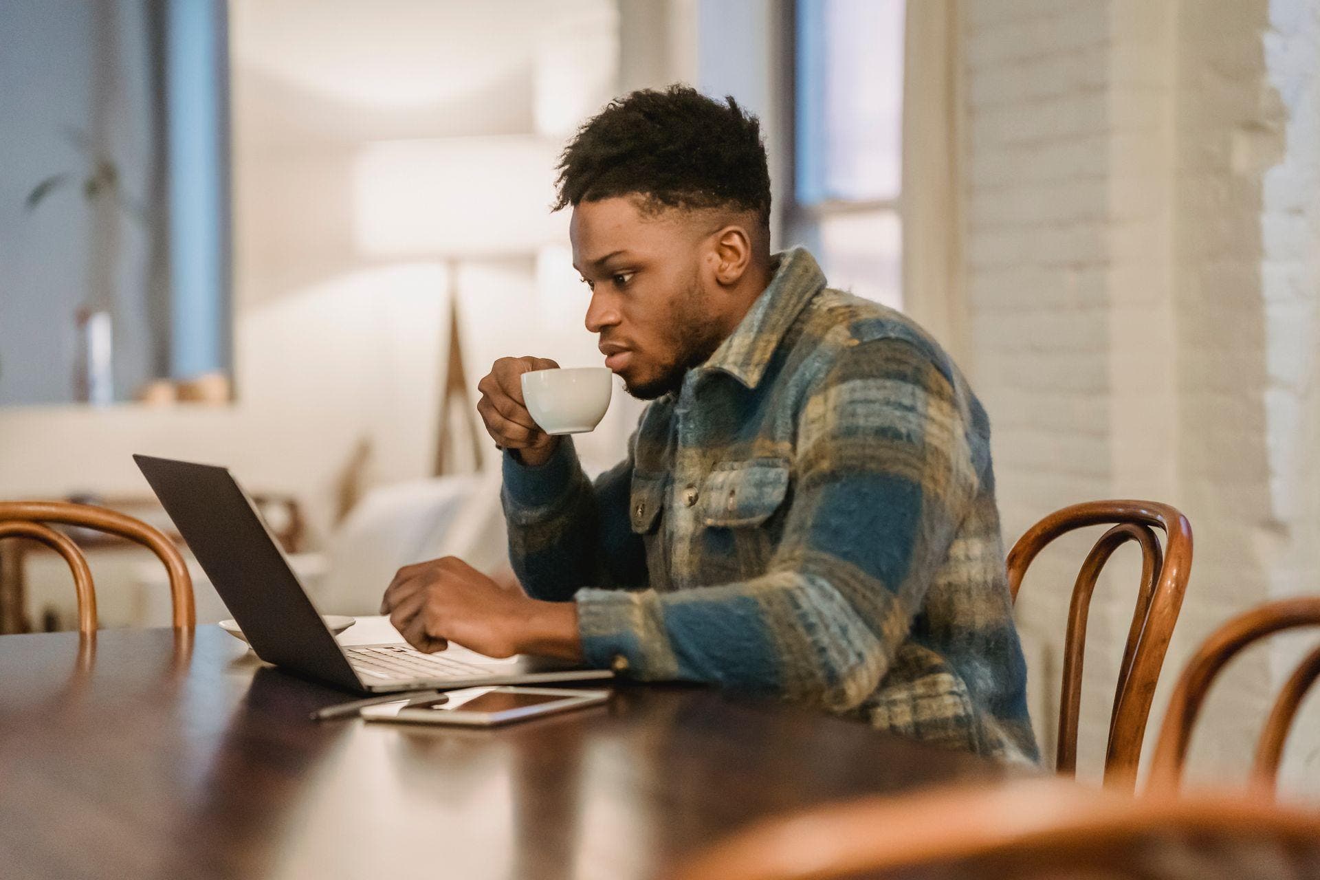 A person at a laptop at home taking an online depression test