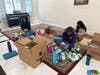 Sakthi Satrawada, Shradha Rachamreddy, and Cerie Huang building feminine hygiene and dental kits.