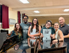 The creative team for Spotlight Players' production of Charlie and the Chocolate Factory gathers during rehearsal. Pictured (left to right): Sophia deSimas, Teddy Kernizan, Emily Rosano, Lauren Hynes, Christine deSimas, and Frank Rosano.