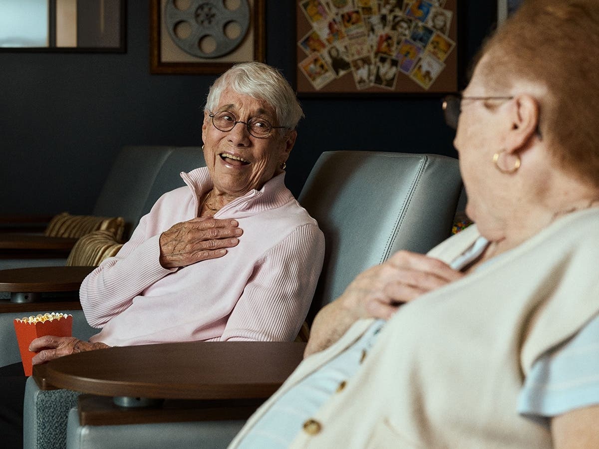 Enjoying a movie with friends is just one of many ways residents experience high-end amenities in a beautifully designed setting, where every space is created to bring people together and make daily life feel both elevated and easy. 