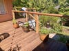 Deck built of fire-resistant Thermory enclosed underneath with cement siding