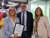 Mayor Karyn Cunningham, Village of Palmetto Bay, sharing a recognition plaque with Patrick Roberts, Head of School and Suzanne Gottlieb Calleja, Associate Head of School for Communications