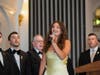 Scholarship recipient Gianna Degaitas sings the Greek National Anthem