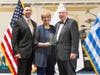 Nikki Samaras Deary accepts the Centennial Honoree Award for her father Spiro C. Samaras