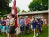 The color guard led by Alex F. of Scout Troop 170 and Pack 170 processes across the museum grounds, marking the official start of the afternoon’s festivities.