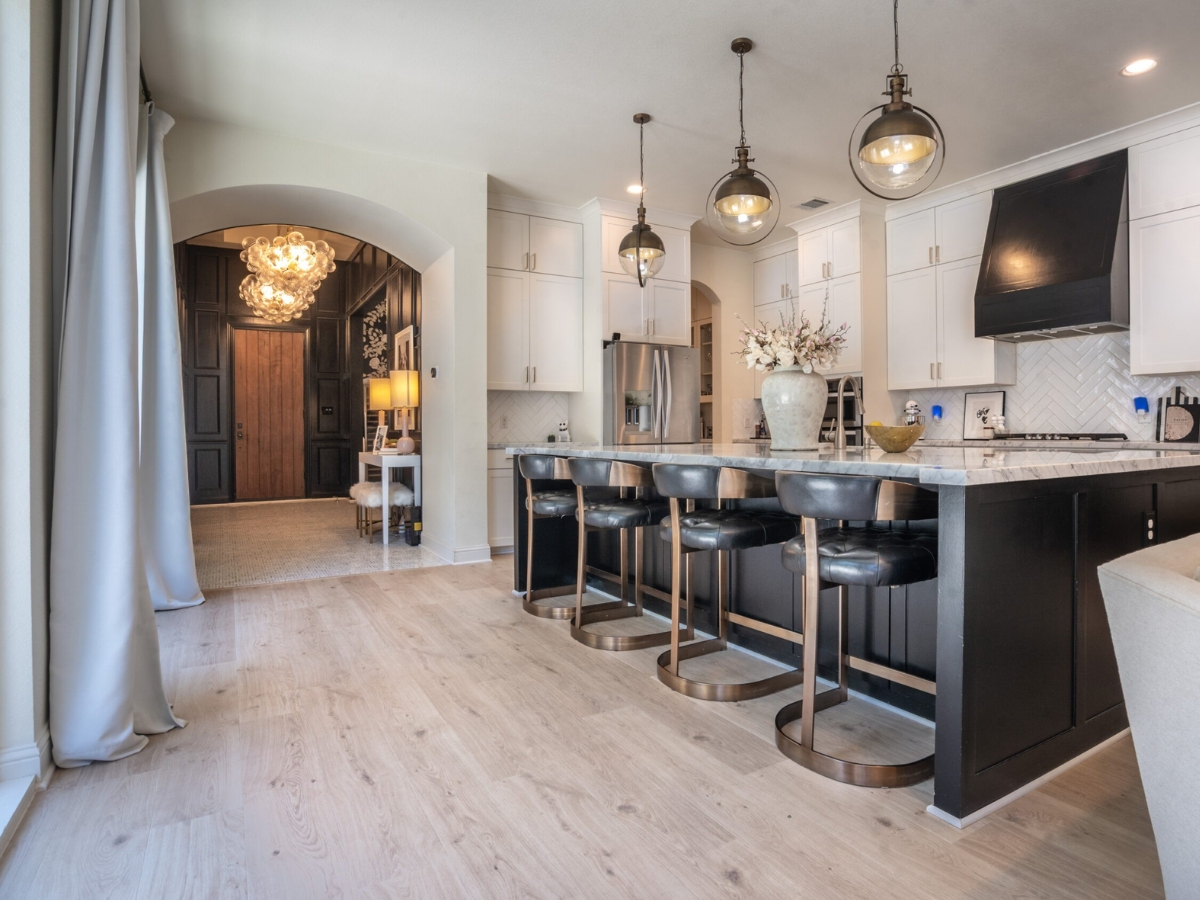 Light wood-look flooring in an open kitchen. Photo: All American Flooring.