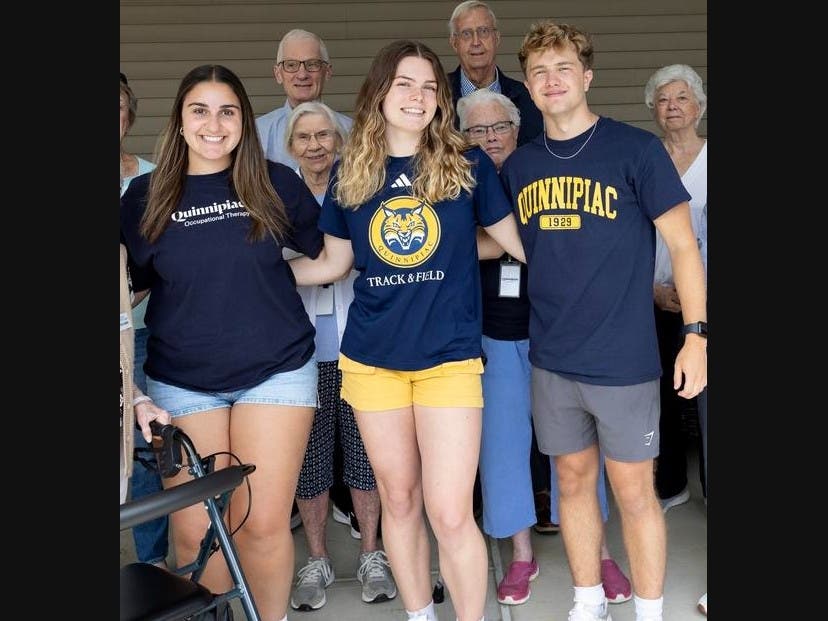 Quinnipiac University students, from left, Danielle Tully, Erin Brennan and Charlie Woolley, are living among older adults through the Students-in-Residence program at Masonicare in Wallingford.