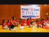 Local students practice CPR on manikins. 