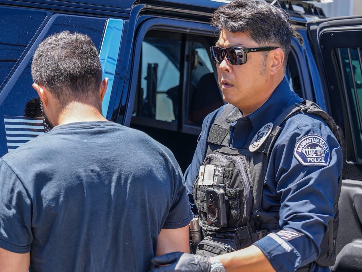 A man was arrested after police found him living inside a Manhattan Beach garage.