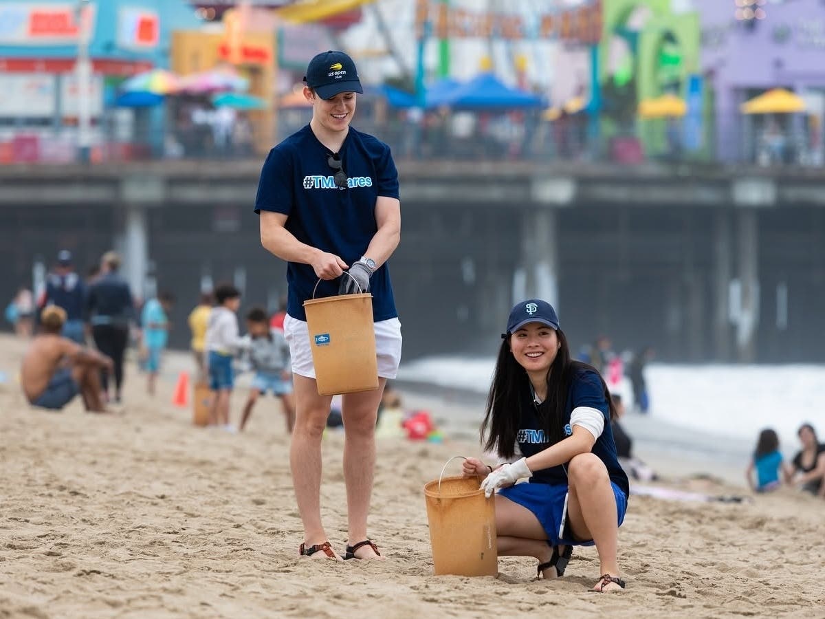 Volunteers collect trash along the westside shoreline during a previous Heal the Bay beach cleanup event.