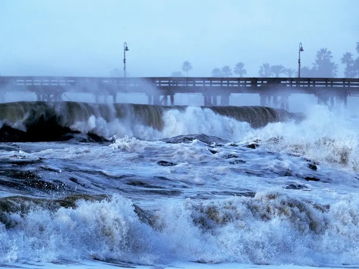 Large waves pound the Long Beach coastline during an earlier swell event, as the city prepares for another round of potentially damaging surf from Hurricane Polo.