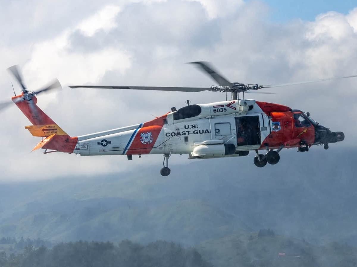 A U.S. Coast Guard helicopter in flight. Coast Guard crews joined the search after a helicopter crashed off Catalina Island Wednesday night, killing two people and leaving one missing.