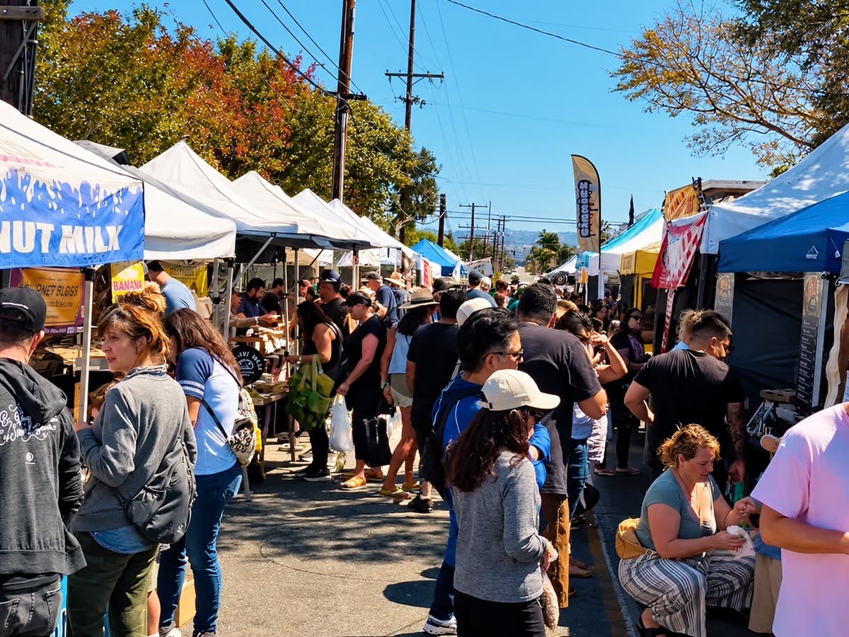 Shoppers browse stalls at the North Redondo Beach Farmers Market, which could become a year-round fixture following a successful six-month pilot program.