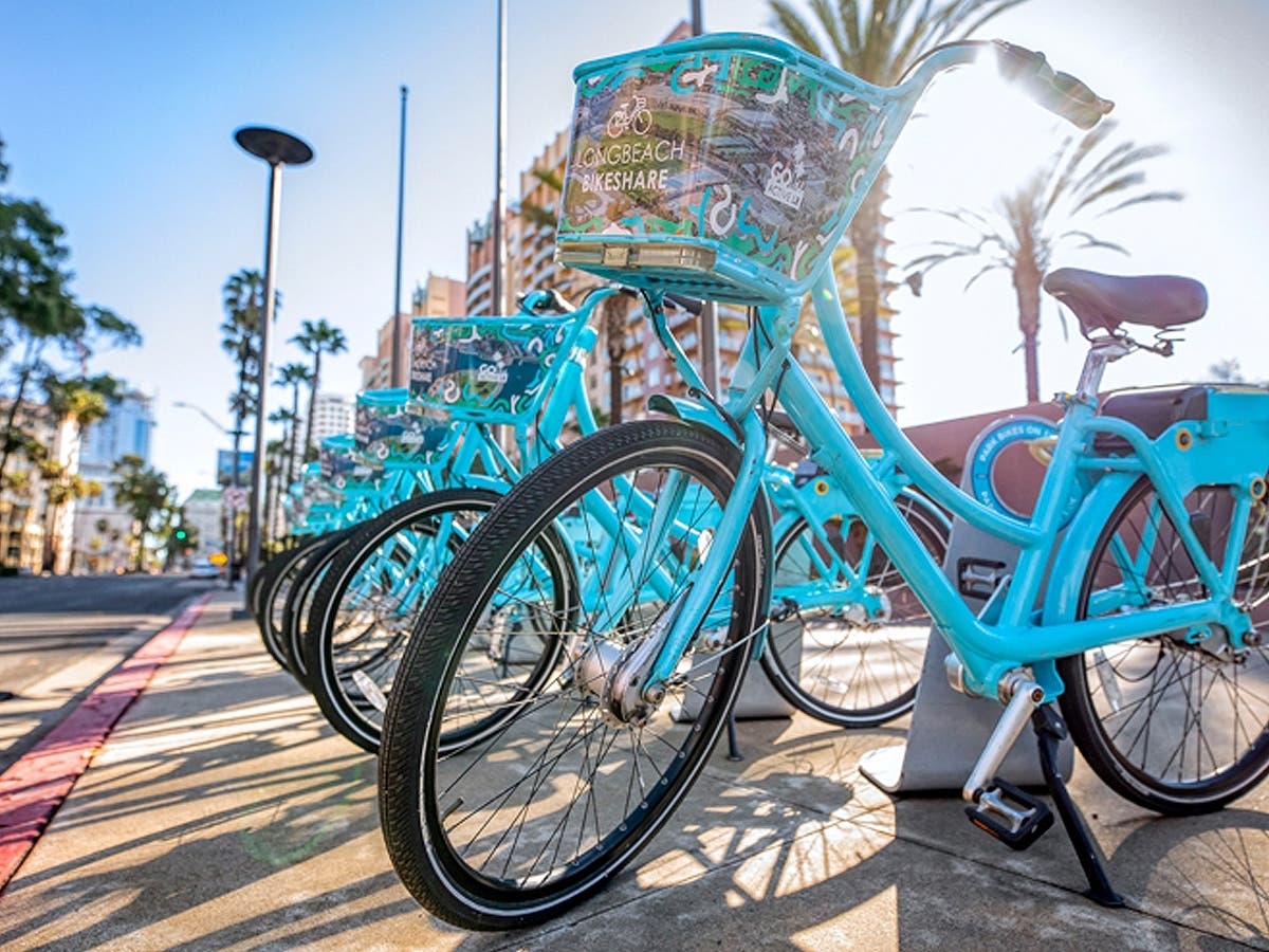 Long Beach BikeShare bicycles parked along a city street. The City Council has approved a $25.7 million contract to modernize the program with a new fleet of electric bicycles beginning in 2027.