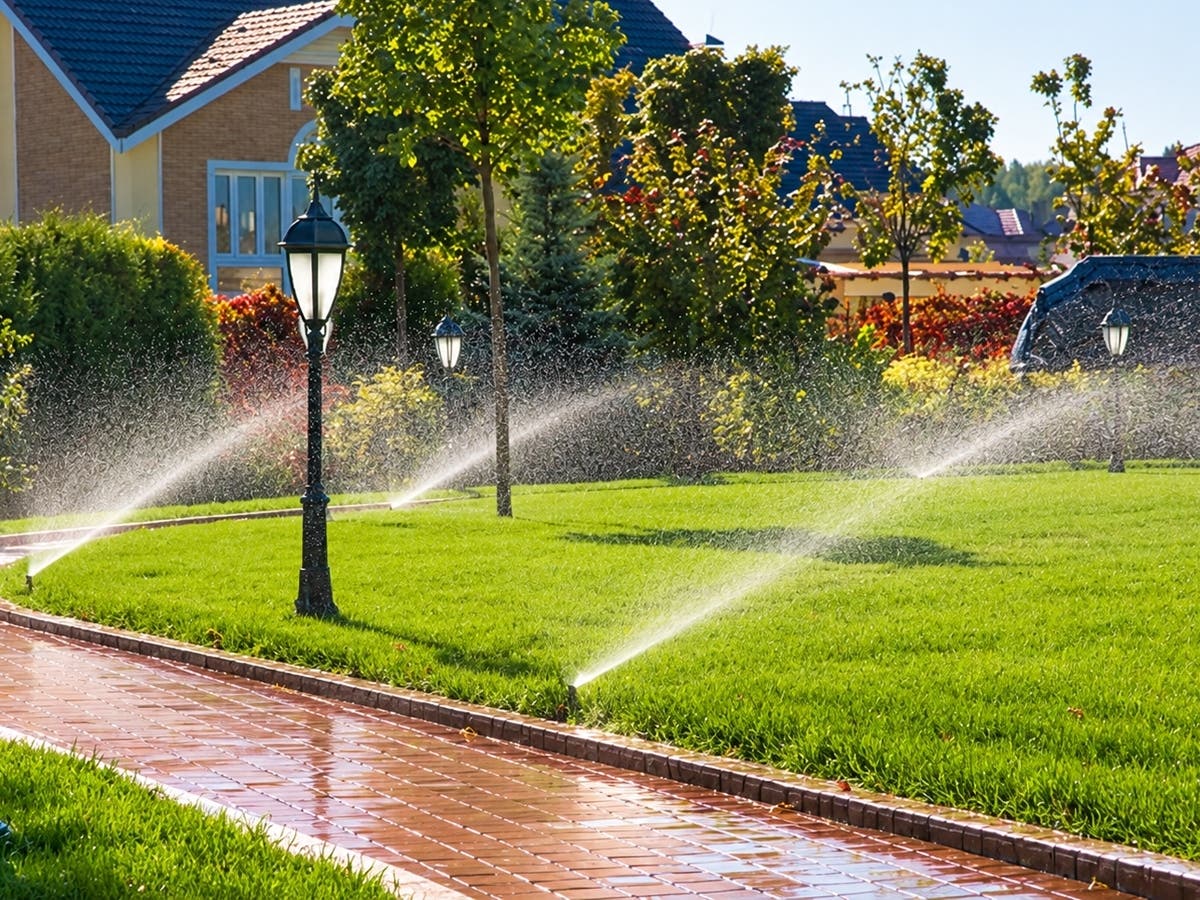 Sprinklers water a landscaped lawn. Santa Monica officials are considering new restrictions on using drinking water to irrigate decorative grass at certain properties, with potential annual savings of 21 million gallons.
