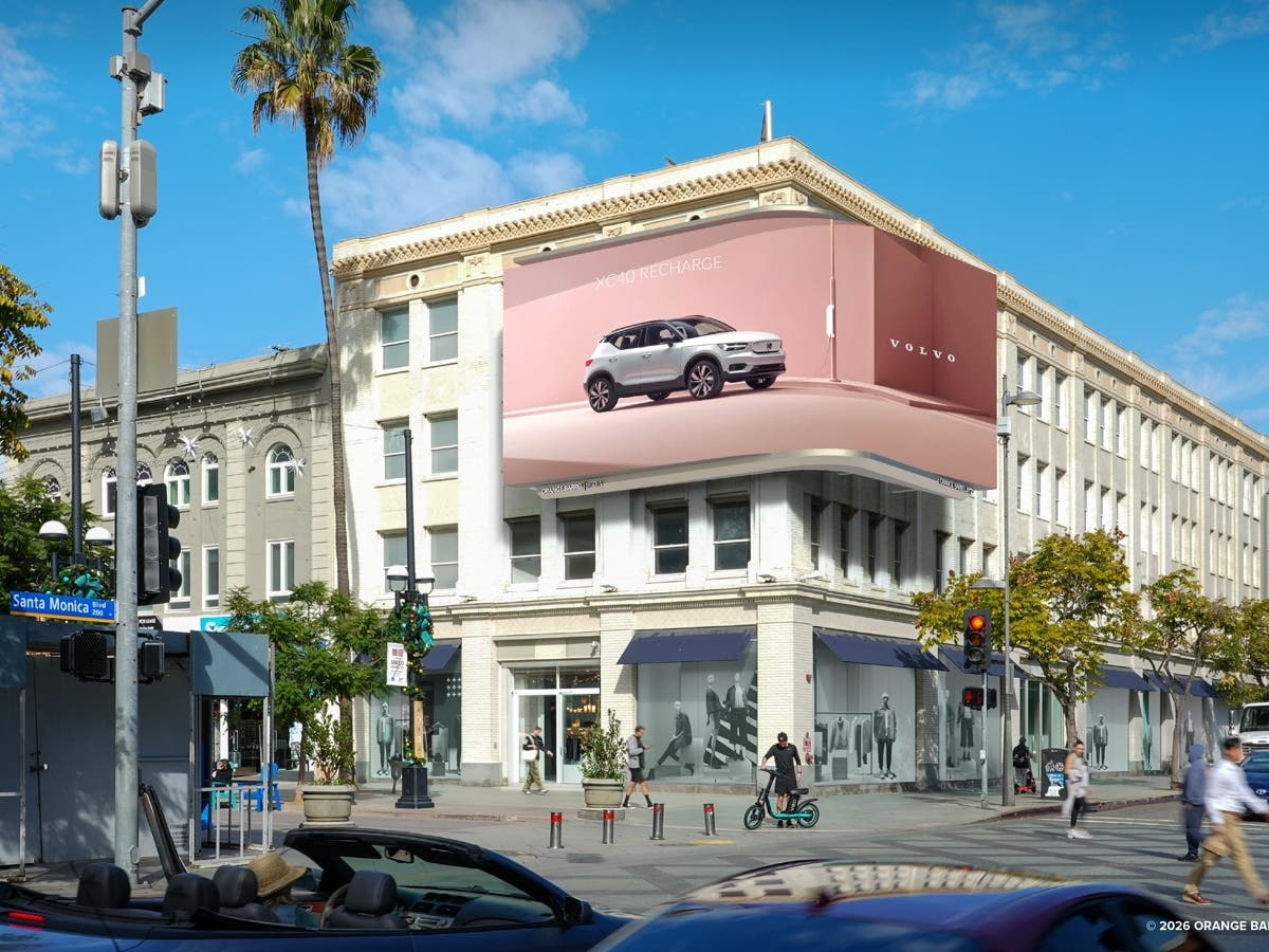 An architectural rendering shows the proposed 1,000-square-foot digital billboard wrapping around the historic Junipher Building at Third Street Promenade and Santa Monica Boulevard.