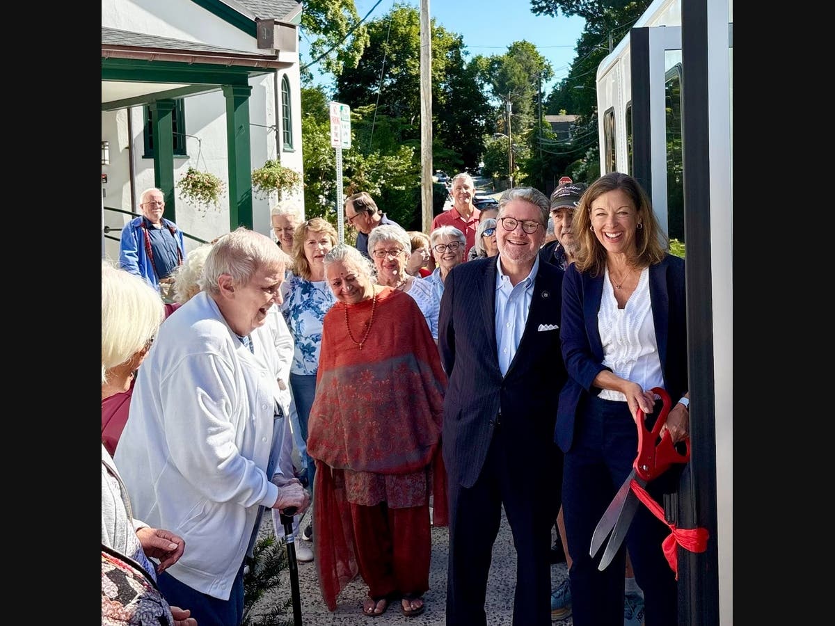 State Sen. Pete Harckham and Bedford Supervisor Ellen Calves at the ribbon cutting for the new bus with Bedford seniors