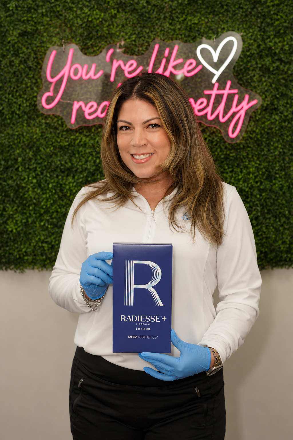 Refresh - Aesthetics & Wellness provider holding a Radiesse+ injectable filler box in Florida