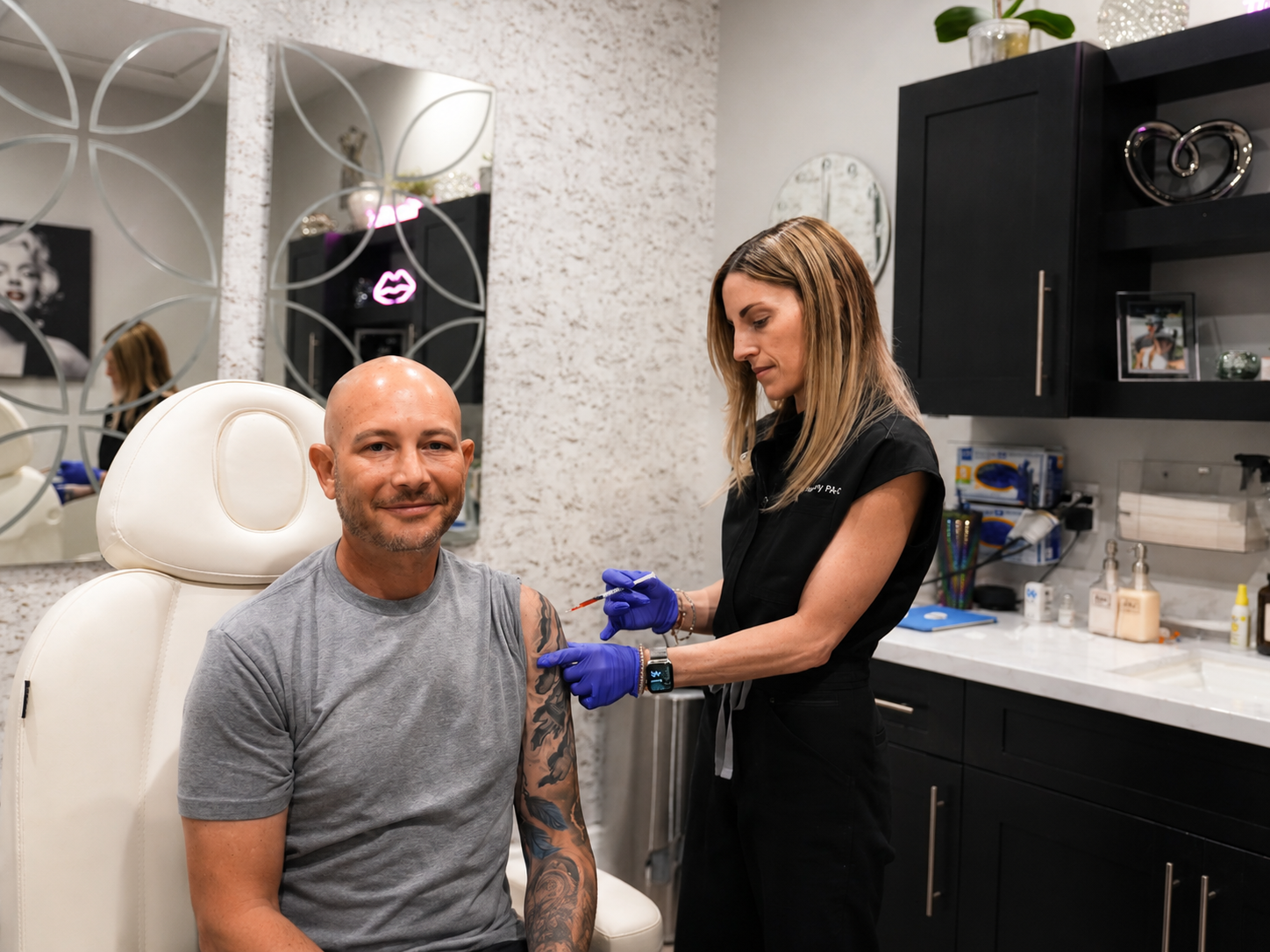 Refresh - Aesthetics & Wellness provider administering a Sermorelin injection to a male patient in a Florida treatment room
