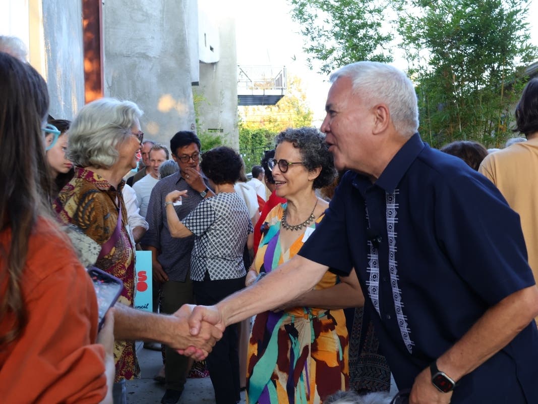 Thomas Aujero Small shakes hands with supporters.