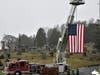A huge American flag provided by the New Milford Fire Department was on display for all to see as volunteers walked the Center Cemetery grounds placing wreaths
