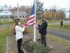 Color Guard Members Tabitha Potok and John Kennedy Prepare  to raise the colors