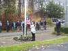 Commander Joseph Beal at right observe the flag raising along with the Detachment from the Jason D. Lewis Brookfield Memorial VFW Post