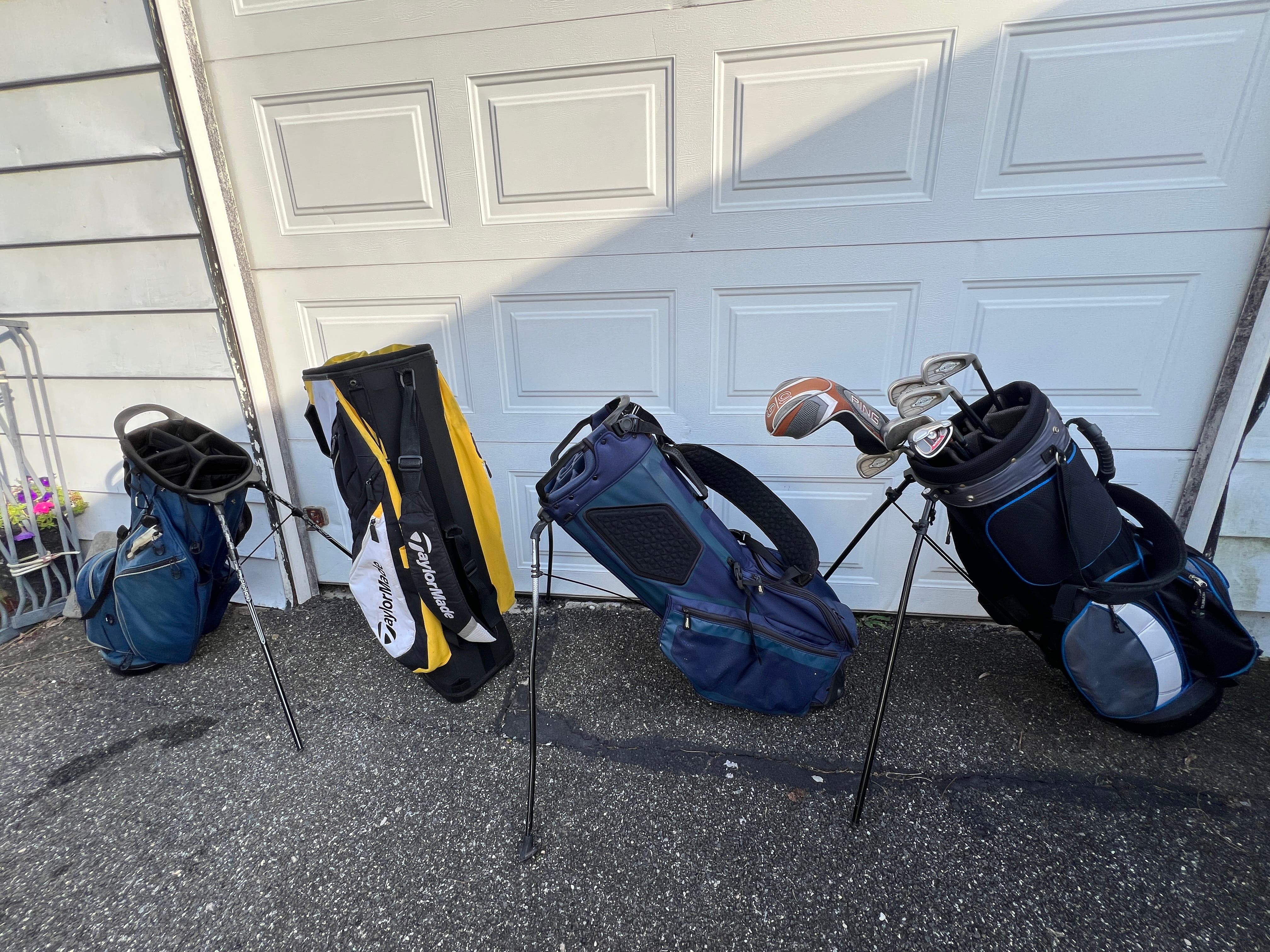 3 golf bags and clubs - just a few clubs left - $50