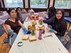 Edison High School student volunteers smile for a picture while assembling peanut butter & jelly sandwiches for an event.