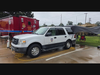 Side view of the Incident Command Post set up. A CAP owned vehicle, Ford Expedition, with a rain fly in the back