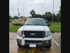 Front view of the Incident Command Post set up. A CAP owned vehicle, Ford Expedition, with a rain fly in the back. 
