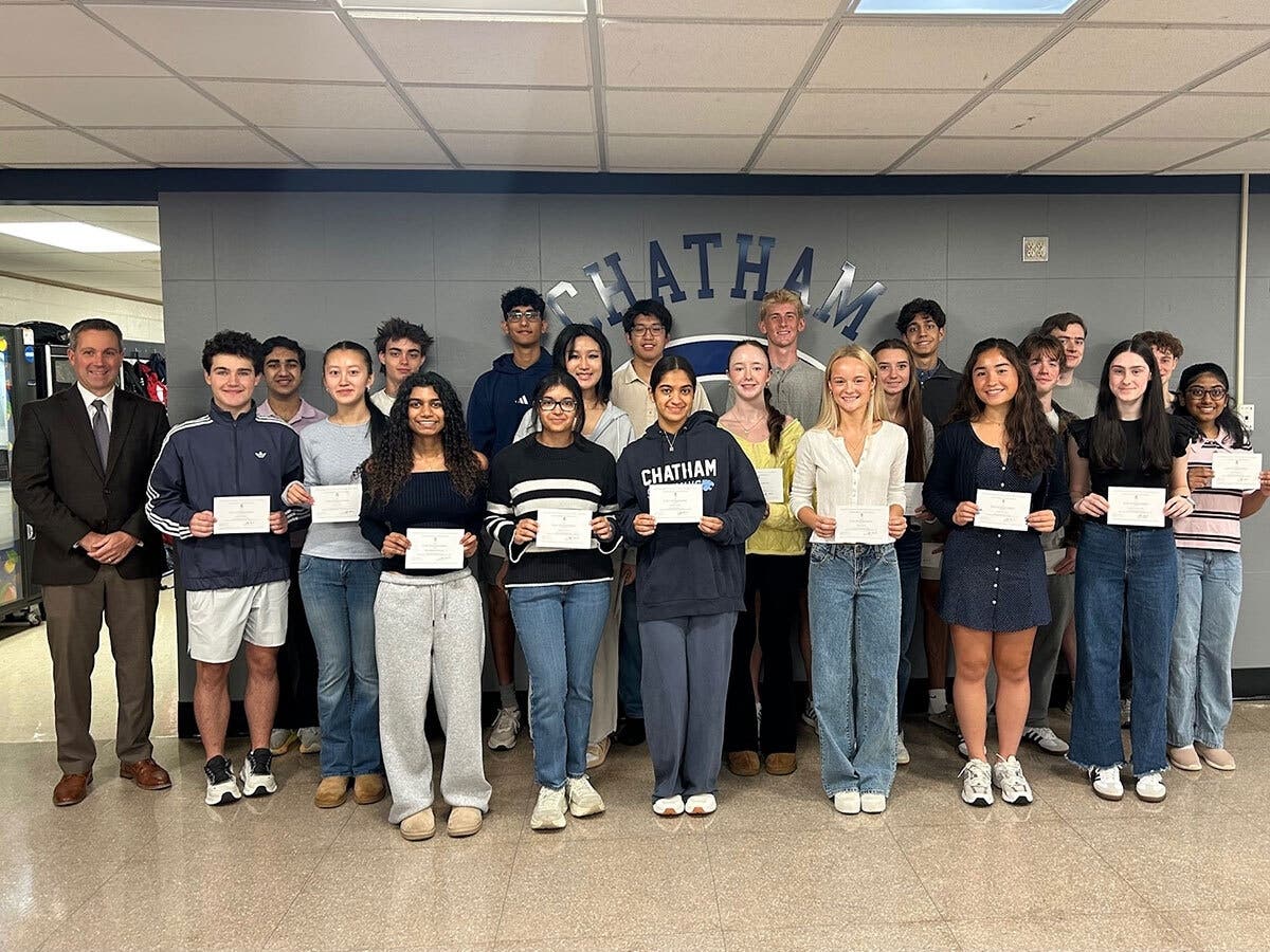 Chatham High School Principal Dr. Doug Walker with the 21 seniors named Commended Students in the 2027 National Merit Scholarship Program.