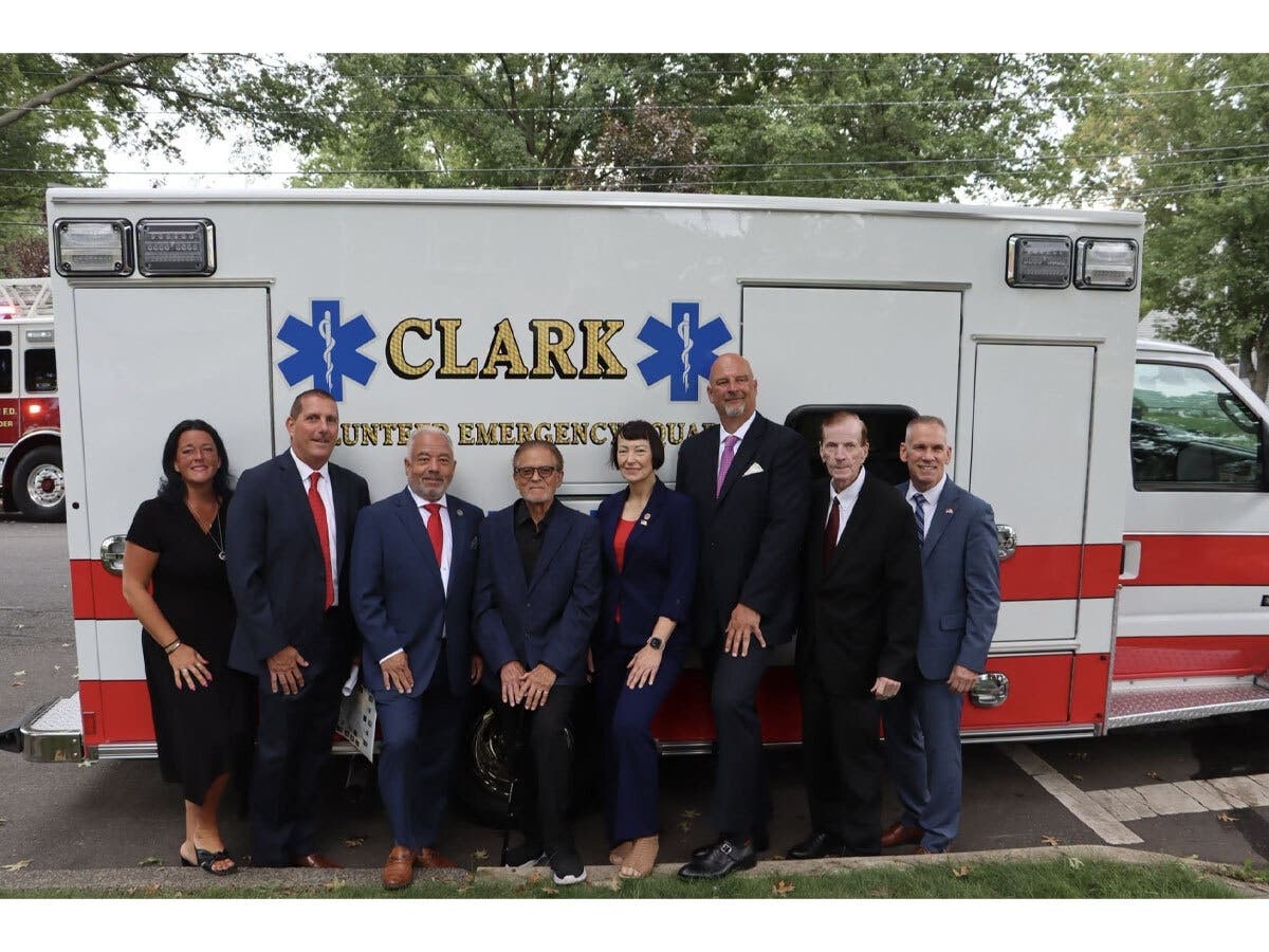 Clark Township officials stand with the Clark Volunteer Emergency Squad’s new 2026 Braun Chief XL ambulance.