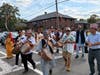 Men playing Nepali traditional musical instruments during the march