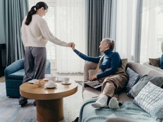 An adult daughter visits her mother at home. In Alabama, the house behind them is usually the asset that sends a family to probate court, and the common do-it-yourself fixes do not apply here.
