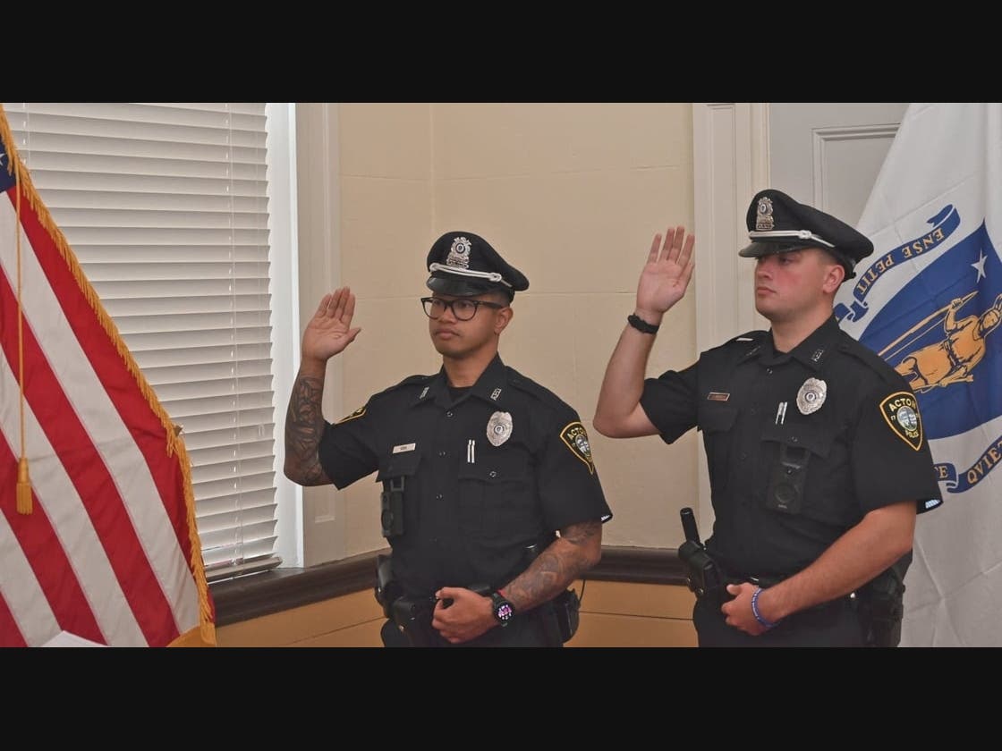 Left to Right, Officer Phannith Sann and Officer James Barry being sworn in by Town Clerk Leo Mercado. Both new officers graduated on Friday from the Lowell Police Academy.