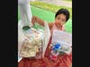 A young attendee places a donation into the relief jar at the September 19 "Pray for Nepal" gathering in Germantown, MD. Funds collected during the event directly support emergency winterization and long-term recovery efforts for flood survivors in Nepal.