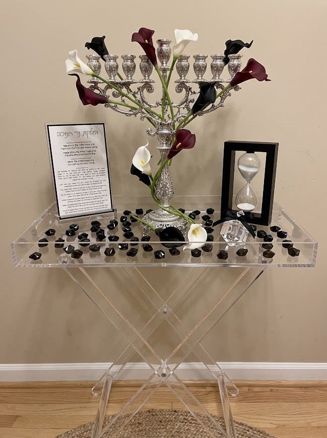 A menorah display idea for Chanukah (Hanukkah): silver menorah with calla lilies