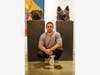 Sculptor Jesse Nusbaum with his English Bulldog and German Shephard at Red Dot Miami in 2015.