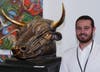 Sculptor Jesse Nusbaum and his Spanish Fighting Bull at Red Dot Miami last December.