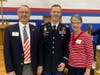 Major Craig Kuphall (WLHS '03) stands with family members after delivering keynote address.
