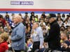 Veterans stand to be honored by students, community, at annual Veterans Day observance event.