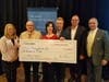 West Bend presents a $10,000 grant to Trinity Services, Inc., supported by L. DeGeus & Associates Insurance.