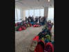 Volunteers at Foley & Lardner’s Milwaukee office with some of the 350 backpacks filled with school supplies for local students.