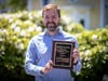 Greg Dolan accepts the Outstanding Community Partner Award on behalf of DCAT