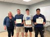Kaarin Robinson, English teacher and DanversCARES Youth Leadership Coordinator at Danvers High School, presents certificates to seniors who participated in Youthworks. Sean Ouellette, Nick Goodwin, Rayyan Kahn. Missing: Lilly Criscuolo, Justin Criscuolo.