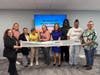 Northeast Arc employees and Journeys participants celebrate ribbon cutting (l-r)Teri Williams, Lauren Tobey, Myrna Solorio, Robyn Vars, Louise Boyd, Jo Ann Simons, Jameswood Charles, Alyessa Knox, and Dionne Keefer.