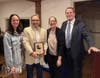 Diana DeLeo (left) and Phil Crawford (right) from A Healthy Lynnfield present the Community Partner Award to Paul Cervizzi and Diana Dustin from Cervizzi's Martial Arts.