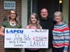 LAFCU’s Alyssa Sliger presents a scholarship to Baker College-bound Julia Pate. Also pictured are Pate’s parents.