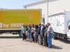 Representatives of Kroger and Greater Lansing Food Bank gather for the dedication of GLFB’s new Food Movers truck, at right. It and another GLFB truck, at left, display the shared goal of Kroger and GLFB: to end hunger by 2025.